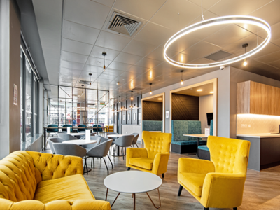 The communal area is filled with bright light and modern furniture
