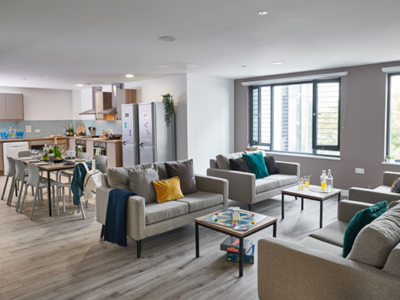 The communal lounge features a dining area and a lounge area
