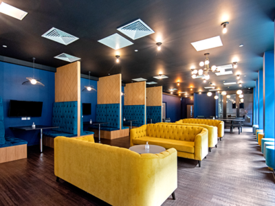 The communal area is decorated in bright and bold luxury colours