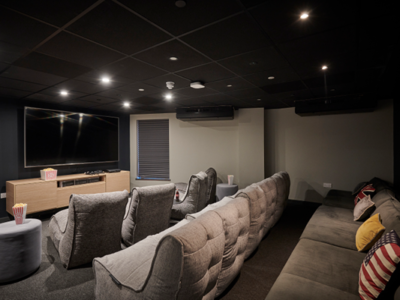 The cinema at Trinity View features a large screen and comfy seating