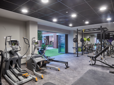 The fully equipped onsite gym at Trinity View features bifolding doors